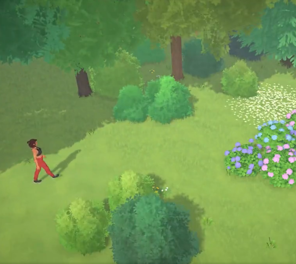 Uma vista de cima caminhando por um jardim com diversos arbustos, e um deles têm uma variedade de flores azuis, rosas, lilás